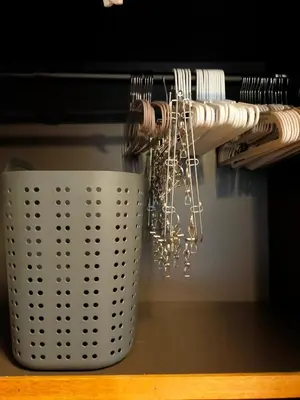 a bunch of utensils hanging from a rack at Shinjuku Vintage Rooftop Terrace Stay in Tokyo
