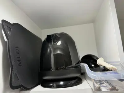 a black helmet sitting on top of a counter at Shinjuku Cloudlive AH in Tokyo