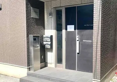 an entrance to a building with a glass door at Monzennakacho Royal Residence in Tokyo