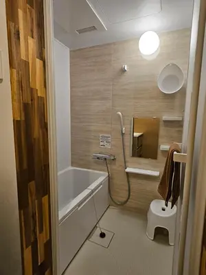 a bathroom with a bath tub and a toilet at Asakusa Stay \u897f\u6d45\u8349 in Tokyo