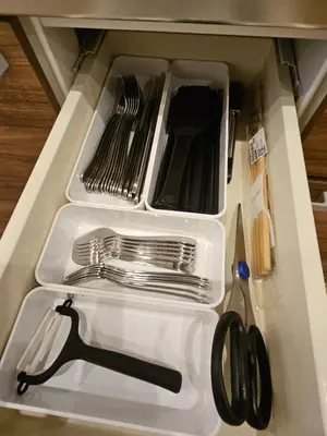 a drawer with forks and utensils in it at Asakusa Stay \u897f\u6d45\u8349 in Tokyo