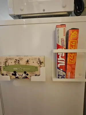 a refrigerator with two cartoons on the side of it at Asakusa Stay \u897f\u6d45\u8349 in Tokyo