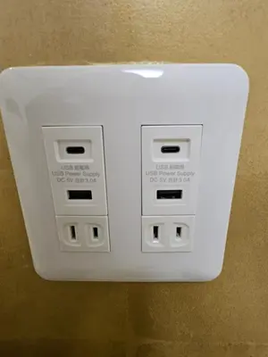 a white electrical outlet on a wall at Asakusa Stay \u897f\u6d45\u8349 in Tokyo