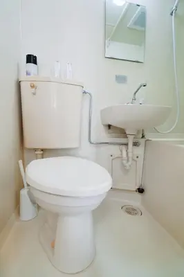 a bathroom with a white toilet and a sink at Home Story in Tokyo KANAMETYOU&Ikebukuro-Ginnzaまで直通&東京屋語 in Tokyo