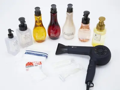 a hair dryer next to a group of bottles at eeGee STAY Kamata