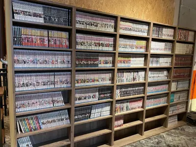 a book shelf filled with dvds at eeGee STAY Kamata