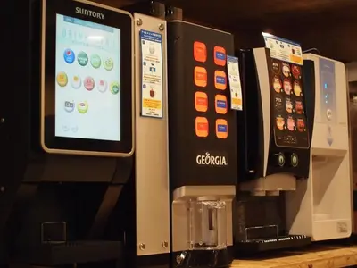 an iphone screen on top of a coffee machine at eeGee STAY Kamata