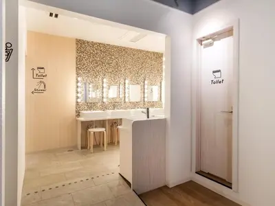 a bathroom with a sink and a mirror at eeGee STAY Kamata
