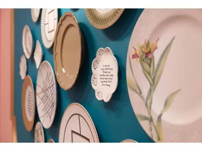 a wall with plates and mirrors on a wall at FourStoriesHotelMaihama Tokyo Bay - Vacation STAY 73118v in Tokyo