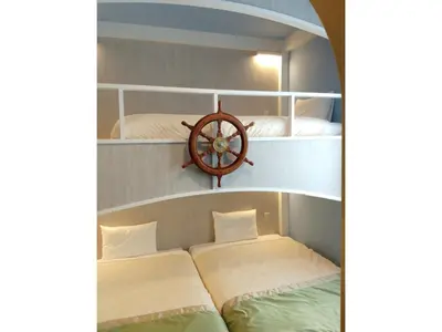 a room with two beds and a wheel on the wall at FourStoriesHotelMaihama Tokyo Bay - Vacation STAY 73118v in Tokyo