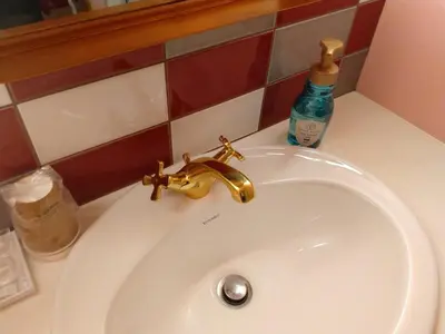 a sink with a faucet and a bottle on a counter at FourStoriesHotelMaihama Tokyo Bay - Vacation STAY 73130v in Tokyo