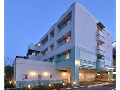 a large white building with lights in front of it at FourStoriesHotelMaihama Tokyo Bay - Vacation STAY 73130v in Tokyo