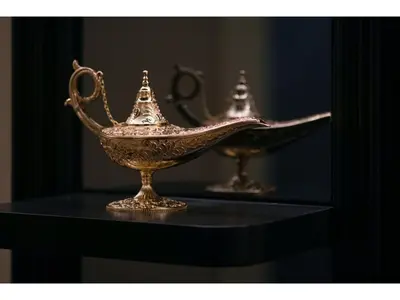 two gold urns sitting on a black table at FourStoriesHotelMaihama Tokyo Bay - Vacation STAY 73113v in Tokyo