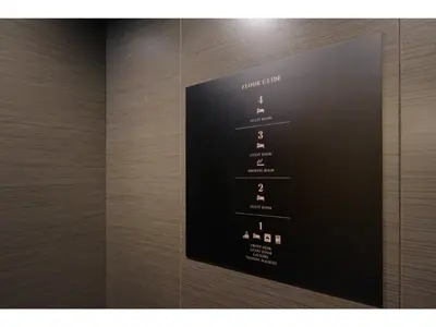 a wall with a display of wine bottles at FourStoriesHotelMaihama Tokyo Bay - Vacation STAY 73113v in Tokyo