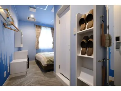 a room with a room with a bed and a door with shoes at FourStoriesHotelMaihama Tokyo Bay - Vacation STAY 73113v in Tokyo