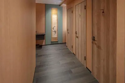a hallway with wooden walls and wooden floors at ENSO TOKYO Akasaka in Tokyo