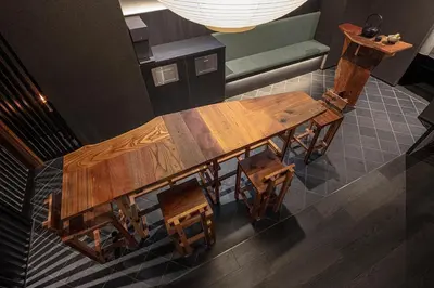 an overhead view of a wooden dining table and chairs at ENSO TOKYO Akasaka in Tokyo