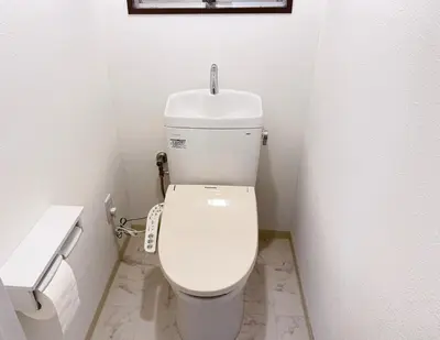 a bathroom with a white toilet in a room at TD Link Ooyama Cozy Escape Sleeps 8 Direct to Ikebukuro in Tokyo