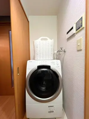 a washing machine sitting inside of a room at Amika First 101 AF11 in Tokyo