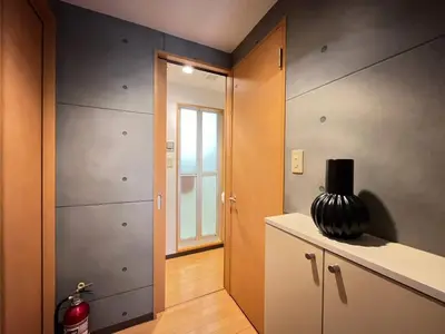 a room with a door and a vase on a counter at Amika First 101 AF11 in Tokyo