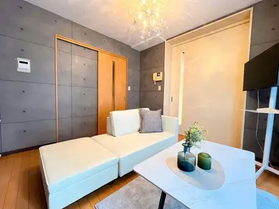 a living room with a white couch and a table at Amika First 101 AF11 in Tokyo