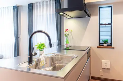 a kitchen with a sink and a window at Poka Villa Aoyama in Tokyo