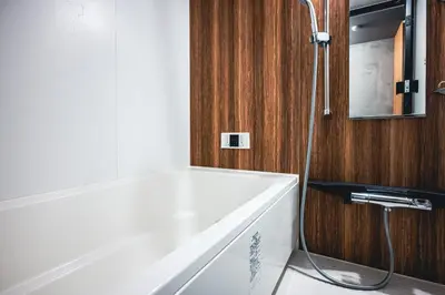 a bathroom with a white tub and a shower at Rimba Tokyo Oshiage, Skytree view, 3BR 80m2 in Tokyo