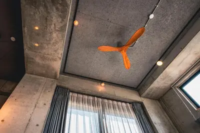 a ceiling fan is hanging from a ceiling at Rimba Tokyo Oshiage, Skytree view, 3BR 80m2 in Tokyo