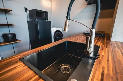 a kitchen with a sink and a lamp on a counter at Rimba Tokyo Oshiage, Skytree view, 3BR 80m2 in Tokyo