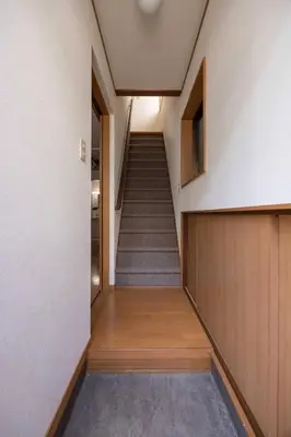 a hallway with a staircase in a building at House Hotel Kagurazaka HHK1 in Tokyo