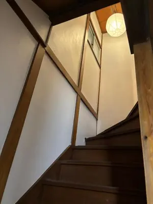 a view from the top of the stairs in a building at Flower House in Tokyo
