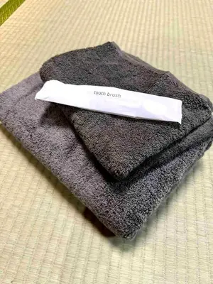a knife sitting on top of a gray towel at Ninja House in Tokyo
