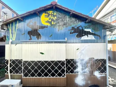a mural of bears on the side of a building at Ninja House in Tokyo