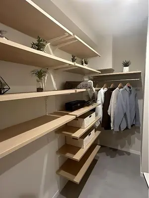 a walk in closet with wooden shelves at Ebisu Top floor 1BR Condo with Mount Fuji view in Tokyo