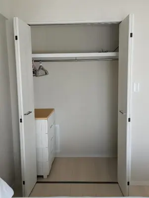 a room with a closet with white walls and wooden floors at Ebisu Top floor 1BR Condo with Mount Fuji view in Tokyo
