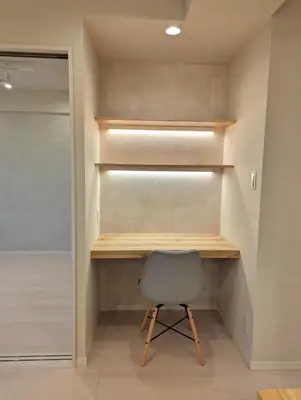 a chair sitting in a room with shelves at Ebisu Top floor 1BR Condo with Mount Fuji view in Tokyo