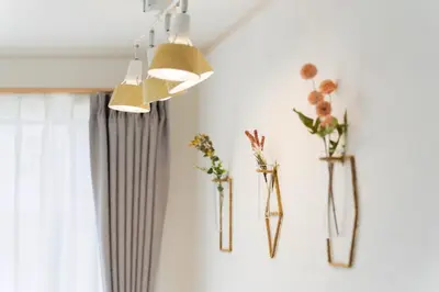 a bunch of flowers in vases on a wall at Magazine Home Tokyo Spacious 93 3BR Skytree7 minutesAsakusa12 minutes by train in Tokyo