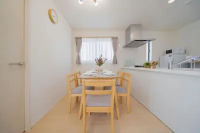 a kitchen with a table and chairs in a room at Magazine Home Tokyo Spacious 93 3BR Skytree7 minutesAsakusa12 minutes by train in Tokyo