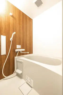 a bath room with a tub and a sink at Home suite Home Ryogoku - Perfect for Families and Groups, Spacious 197m2 Home with 8 BR & 3 BA, Up to 15 ppl with Parking and 3 Stations in Tokyo