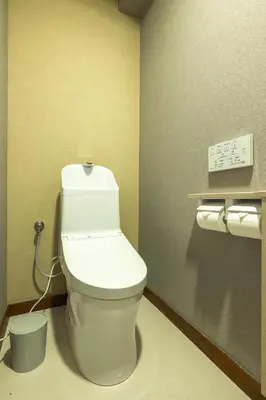 a bathroom with a white toilet in a room at Home suite Home Ryogoku - Perfect for Families and Groups, Spacious 197m2 Home with 8 BR & 3 BA, Up to 15 ppl with Parking and 3 Stations in Tokyo