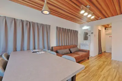 a living room with a couch and a table at V Close to Shinjuku Kabukicho Korean Town FrWIFI M in Tokyo
