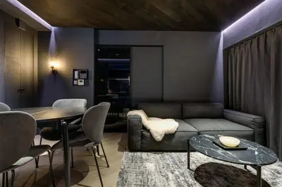 a living room with a couch and a table at THE LIVRE Apartment Hotel in Tokyo
