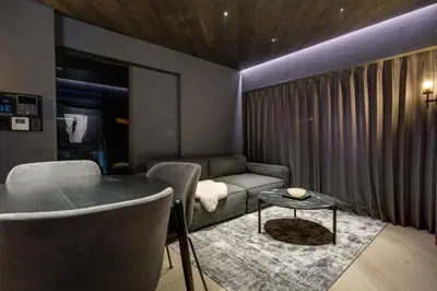 a living room with a couch and a table at THE LIVRE Apartment Hotel in Tokyo