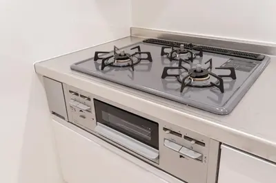 a stove top oven sitting inside of a kitchen at House hotel EKODA 101 HE11 in Tokyo