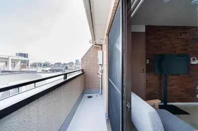 a balcony with a view of a building at Luce Ikebukuro - Cozy APT Stay in Ikebukuro Tokyo, with Direct Access to Shinjuku & Shibuya in Tokyo