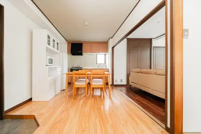 a kitchen and dining room with a table and chairs at Luce Ikebukuro - Cozy APT Stay in Ikebukuro Tokyo, with Direct Access to Shinjuku & Shibuya in Tokyo