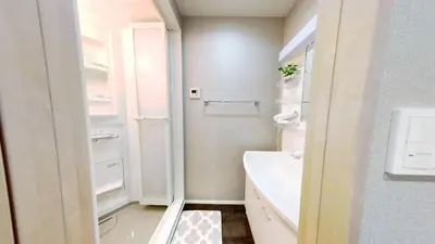 a white bathroom with a sink and a toilet at \u30db\u30c6\u30ebYado SK \u65b0\u5c0f\u5ca9 \u99c5\u5f92\u6b694\u5206 in Tokyo