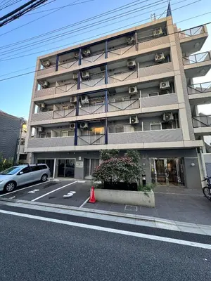 a large building with a car parked in front of it at Ikebukuro 302 - Twin Room in Tokyo