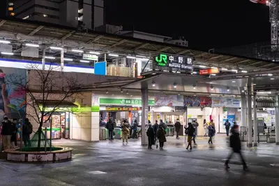 a group of people walking outside of a building at night at Near Shinjuku Nakano unit 3 Walking 4 Mins Broadway No2 in Tokyo