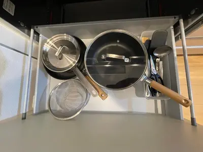 a group of pans and utensils in a kitchen at MU HOUSE Ikebukuro \u6c60\u888b\u99c5\u8eca1\u5206 in Tokyo